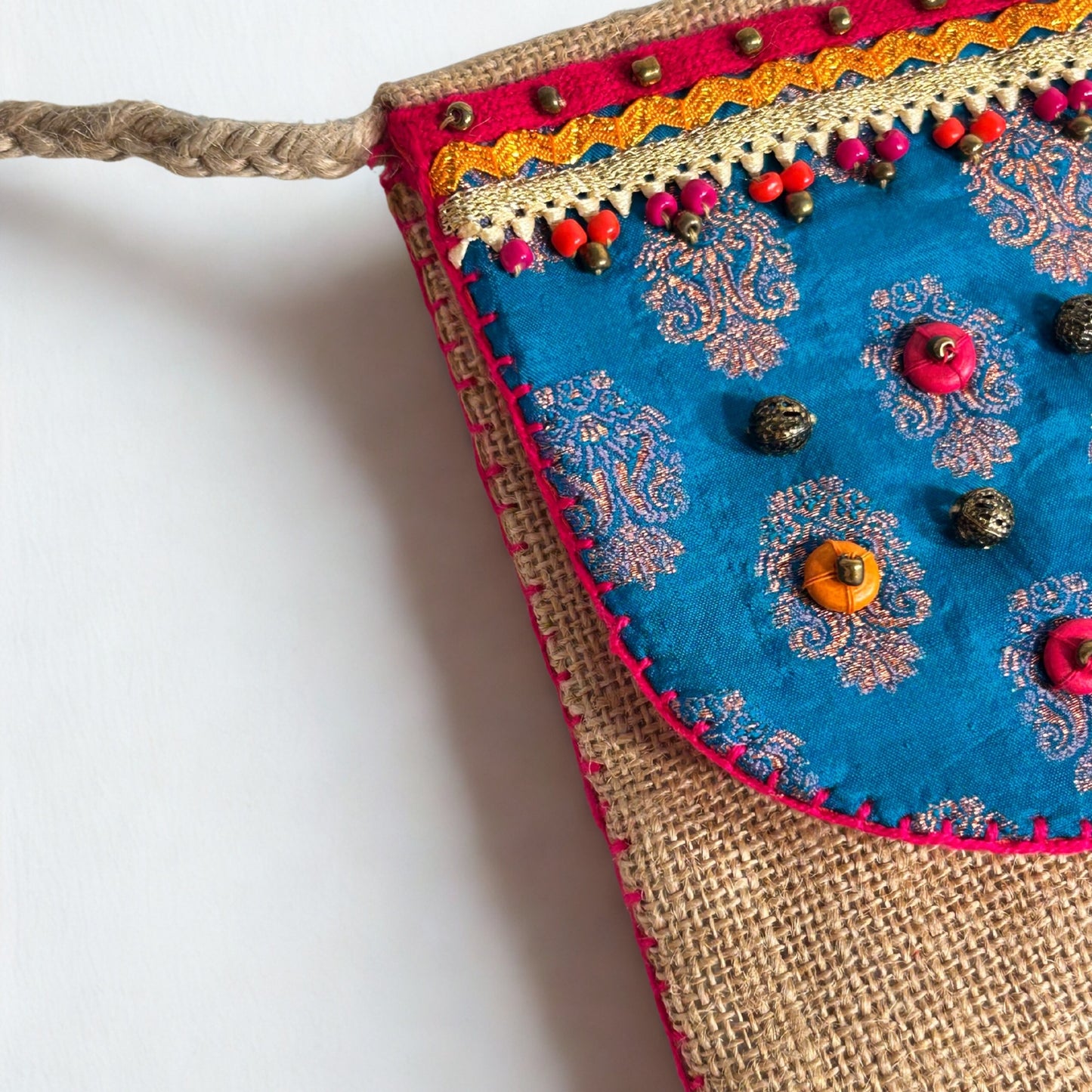 NATURAL JUTE CROSSBODY BAG WITH BLUE AND PINK ACCENTS