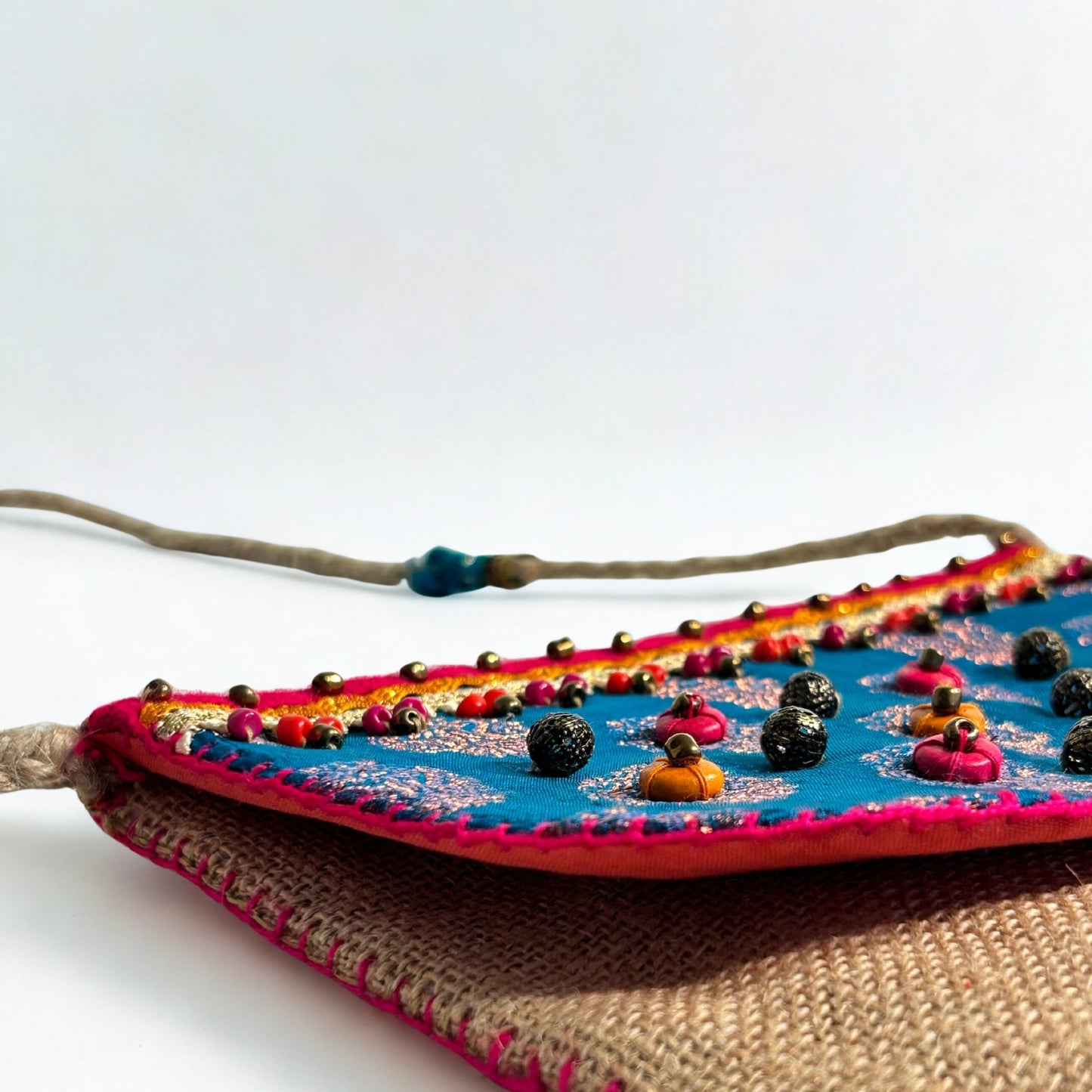NATURAL JUTE CROSSBODY BAG WITH BLUE AND PINK ACCENTS