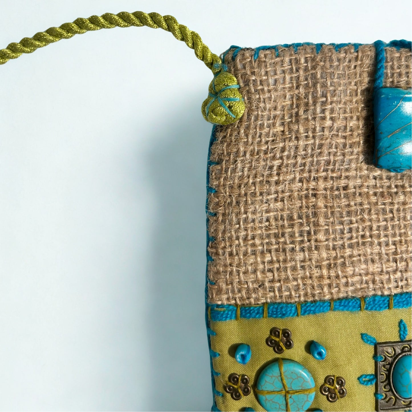 NATURAL JUTE PHONE BAG WITH TURQUOISE AND GREEN ACCENTS