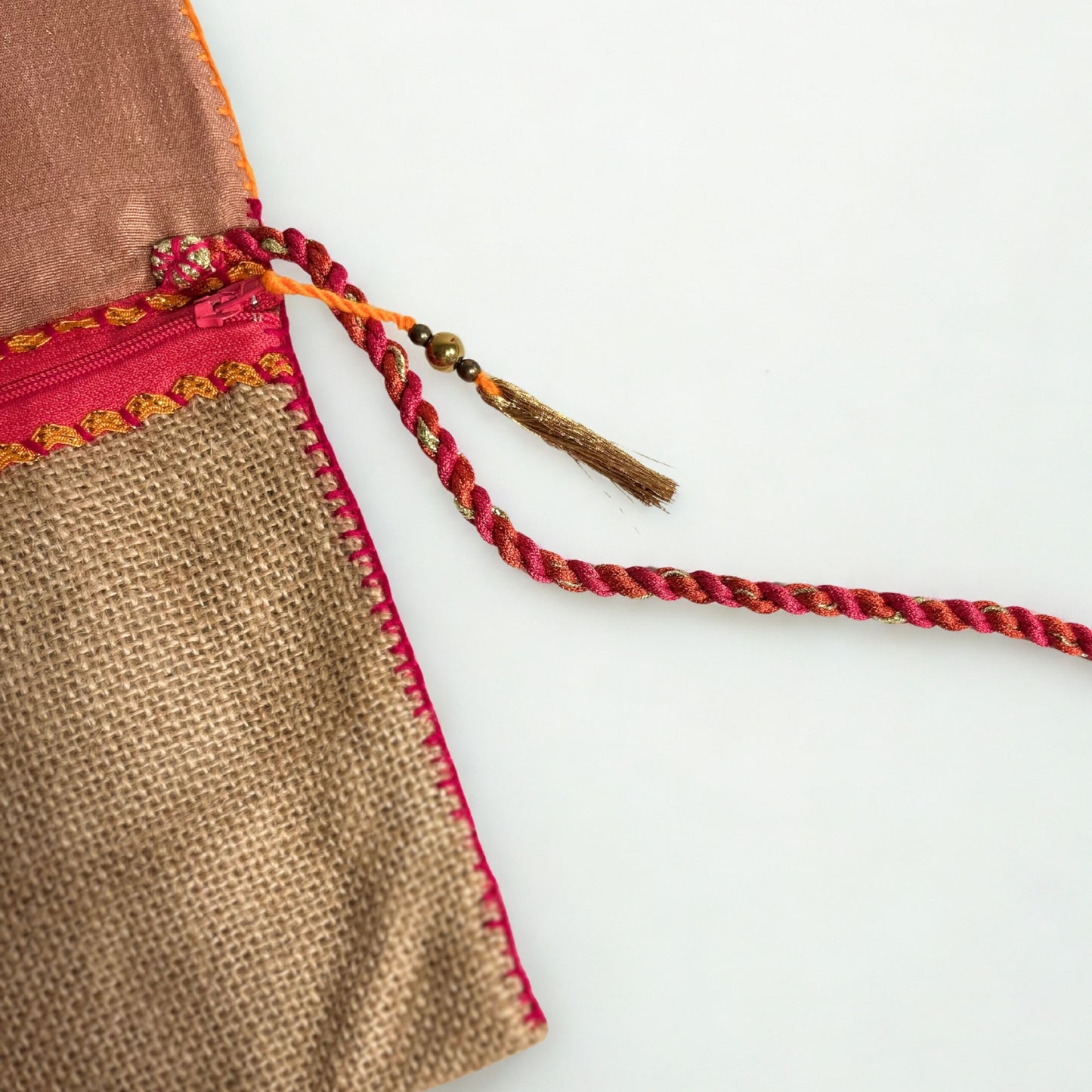 NATURAL JUTE CLUTCH BAG WITH MAROON AND ORANGE ACCENTS